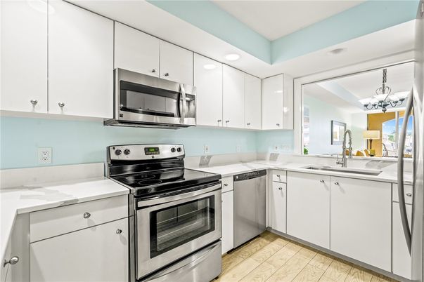 Chandelier, Interior, Kitchen, Recessed Lighting, Stainless Steel Appliances, Wood Texture Flooring