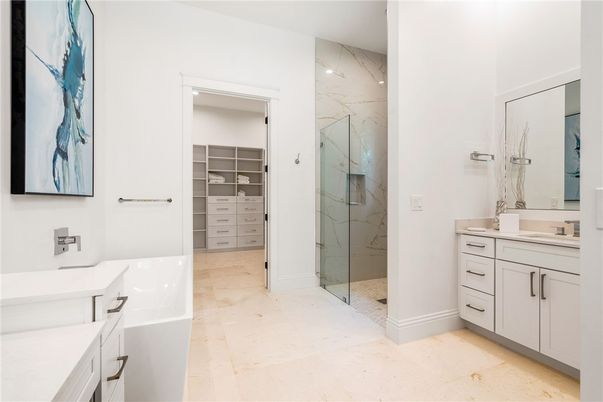 Bathroom, Dual Sink Vanities, Glass Shower, Interior, Marble Walls, Walk-in Closets