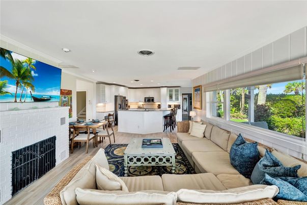 Dining room, Fireplace, Interior, Kitchen, Living room, Recessed Lighting, Stainless Steel Appliances, Wood Texture Flooring