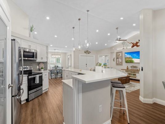 Dining room, Interior, Kitchen, Pendant Lights, Recessed Lighting, Stainless Steel Appliances, Wood Texture Flooring