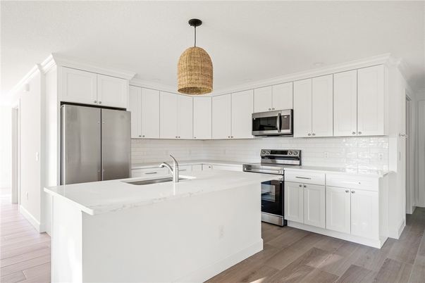 Interior, Kitchen, Pendant Lights, Recessed Lighting, Stainless Steel Appliances, Wood Texture Flooring
