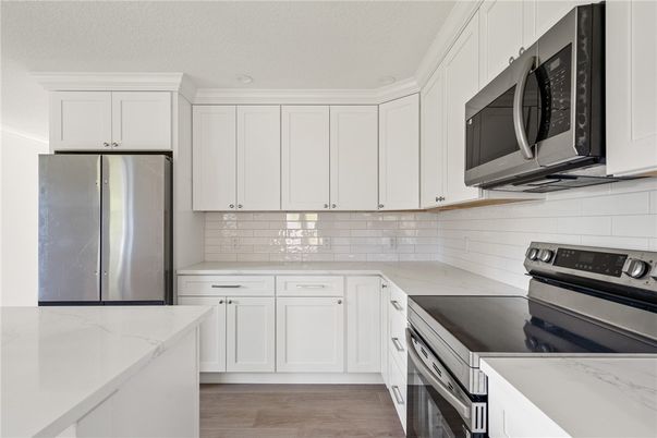 Interior, Kitchen, Recessed Lighting, Stainless Steel Appliances, Wood Texture Flooring