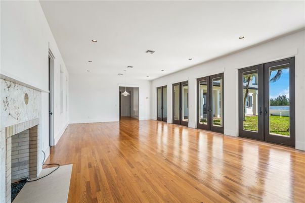 Empty room, Fireplace, Interior, Pendant Lights, Recessed Lighting, Wood Texture Flooring