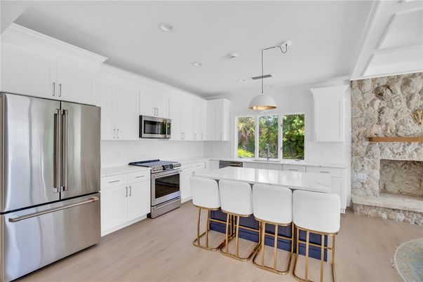Fireplace, Interior, Kitchen, Pendant Lights, Recessed Lighting, Stainless Steel Appliances, Wood Texture Flooring