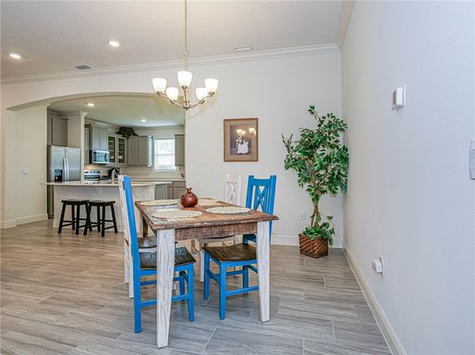 Chandelier, Dining room, Interior, Kitchen, Recessed Lighting, Stainless Steel Appliances, Wood Texture Flooring
