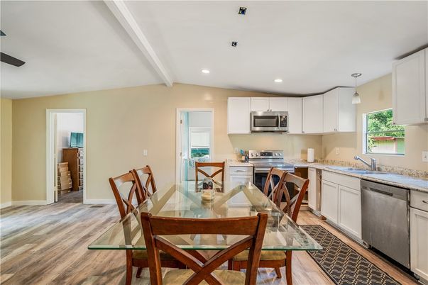 Dining room, Interior, Kitchen, Pendant Lights, Recessed Lighting, Stainless Steel Appliances, Wood Texture Flooring