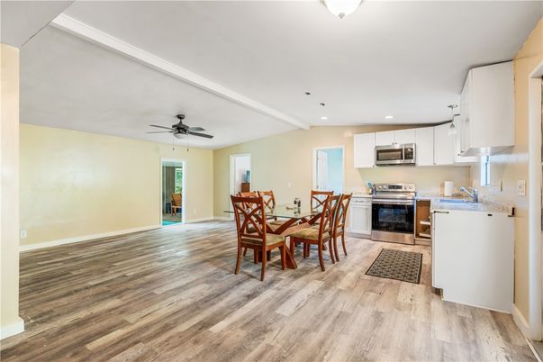 Dining room, Interior, Kitchen, Recessed Lighting, Stainless Steel Appliances, Wood Texture Flooring