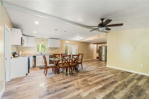 Dining room, Interior, Kitchen, Recessed Lighting, Stainless Steel Appliances, Wood Texture Flooring