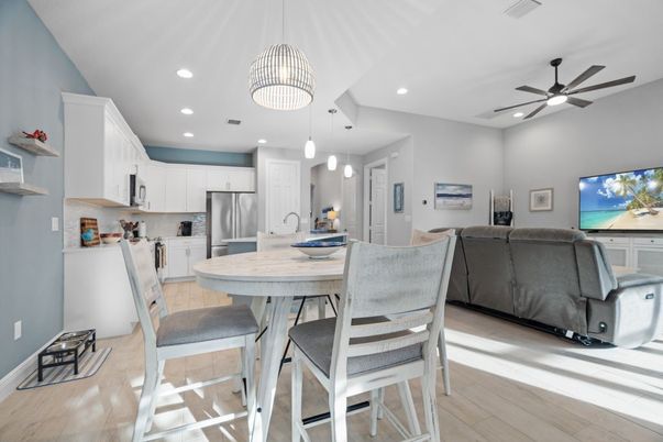 Dining room, Interior, Kitchen, Living room, Pendant Lights, Recessed Lighting, Stainless Steel Appliances, Wood Texture Flooring