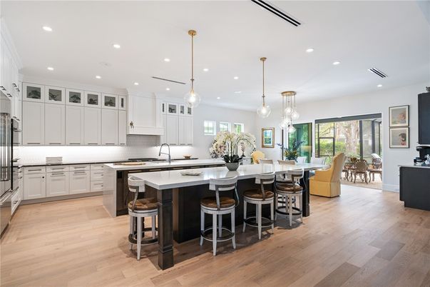 Dining room, Interior, Kitchen, Pendant Lights, Recessed Lighting, Stainless Steel Appliances, Wood Texture Flooring
