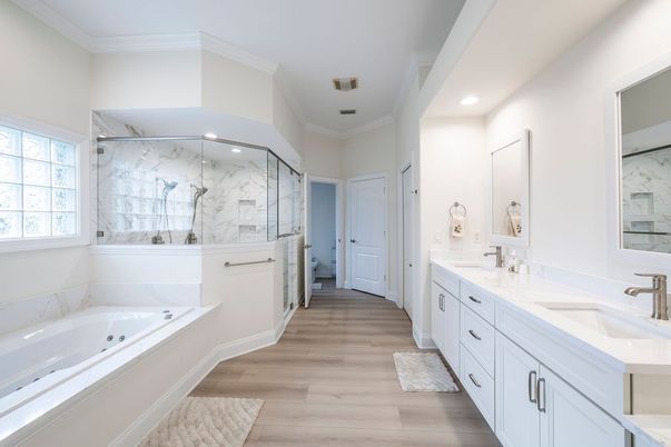 Bathroom, Dual Sink Vanities, Glass Shower, Interior, Marble Walls, Recessed Lighting, Wood Texture Flooring