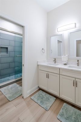 Bathroom, Dual Sink Vanities, Glass Shower, Interior, Wood Texture Flooring