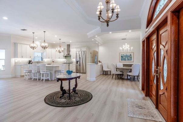 Chandelier, Dining room, Interior, Kitchen, Pendant Lights, Recessed Lighting, Stainless Steel Appliances, Wood Texture Flooring