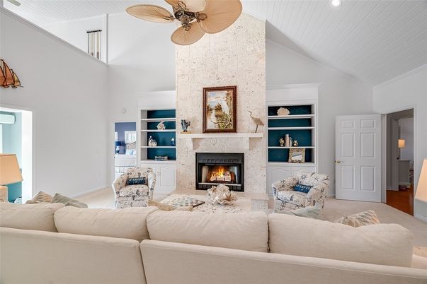 Fireplace, Interior, Living room, Recessed Lighting, Stone Walls, Wood Texture Flooring