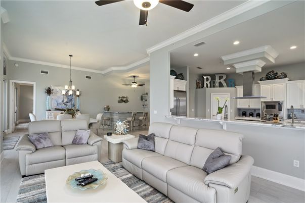 Chandelier, Dining room, Interior, Kitchen, Living room, Recessed Lighting, Stainless Steel Appliances, Wood Texture Flooring
