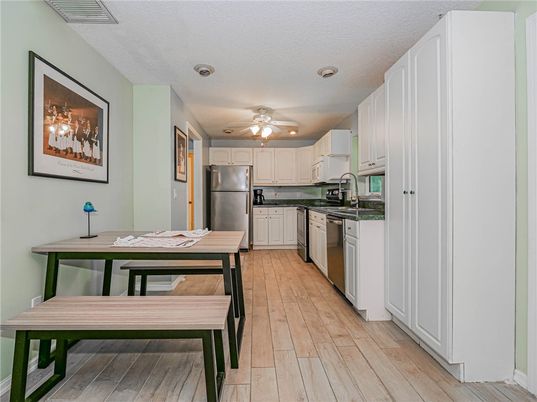 Interior, Kitchen, Recessed Lighting, Stainless Steel Appliances, Wood Texture Flooring