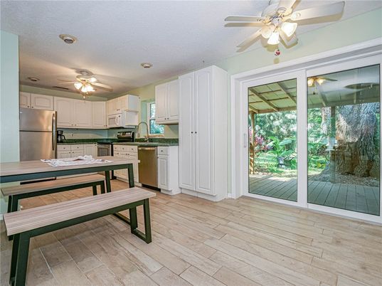 Dining room, Interior, Kitchen, Recessed Lighting, Stainless Steel Appliances, Wood Texture Flooring