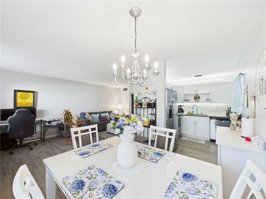 Chandelier, Dining room, Interior, Kitchen, Living room, Stainless Steel Appliances, Wood Texture Flooring