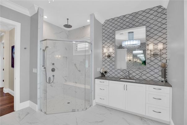 Bathroom, Chandelier, Glass Shower, Interior, Marble, Marble Walls, Recessed Lighting, Wood Texture Flooring