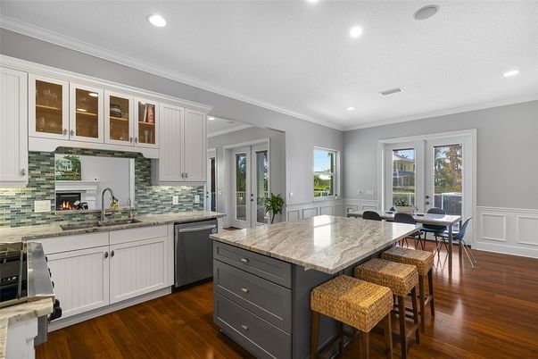 Dining room, Fireplace, Interior, Kitchen, Recessed Lighting, Stainless Steel Appliances, Wood Texture Flooring
