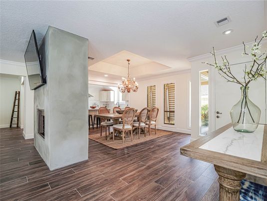 Chandelier, Dining room, Fireplace, Interior, Recessed Lighting, Wood Texture Flooring