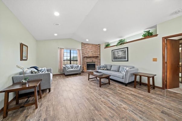 Fireplace, Interior, Living room, Recessed Lighting, Stone Walls, Wood Texture Flooring