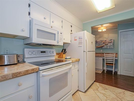 Interior, Kitchen, Tile Countertops, Wood Texture Flooring