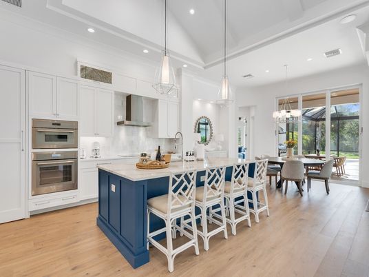 Chandelier, Dining room, Interior, Kitchen, Pendant Lights, Recessed Lighting, Stainless Steel Appliances, Wood Texture Flooring