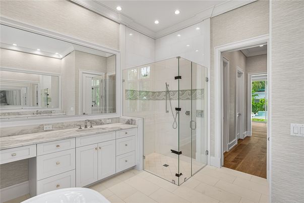 Bathroom, Dual Sink Vanities, Glass Shower, Interior, Recessed Lighting, Wood Texture Flooring