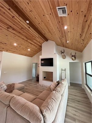 Fireplace, Interior, Living room, Recessed Lighting, Wooden Ceilings, Wood Texture Flooring