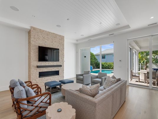 Fireplace, Interior, Living room, Recessed Lighting, Stone Walls, Wood Texture Flooring