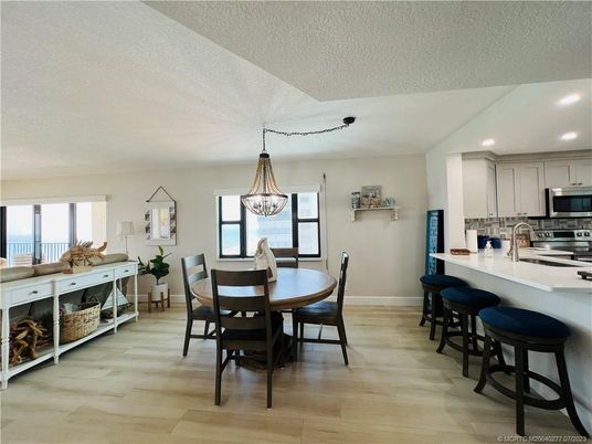 Dining room, Interior, Kitchen, Pendant Lights, Recessed Lighting, Stainless Steel Appliances, Wood Texture Flooring