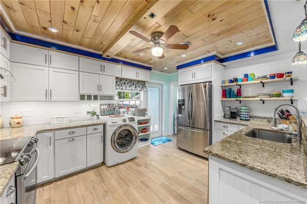 Interior, Kitchen, Recessed Lighting, Stainless Steel Appliances, Washer, Wooden Ceilings, Wood Texture Flooring