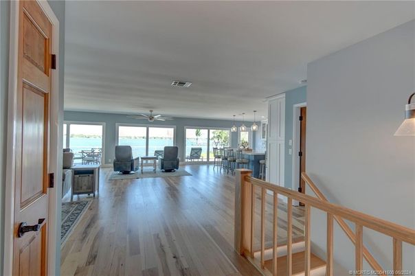 Dining room, Fireplace, Interior, Pendant Lights, Water, Wood Texture Flooring