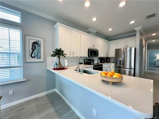Interior, Kitchen, Recessed Lighting, Stainless Steel Appliances, Wood Texture Flooring