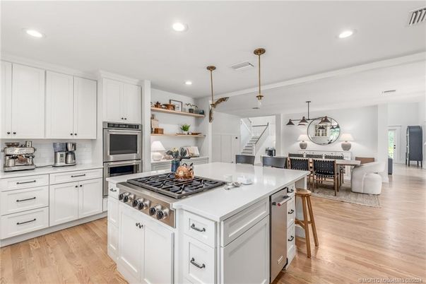 Dining room, Interior, Kitchen, Living room, Pendant Lights, Recessed Lighting, Stainless Steel Appliances, Wood Texture Flooring