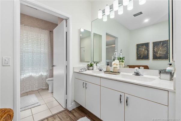 Bathroom, Dual Sink Vanities, Interior, Recessed Lighting, Wood Texture Flooring