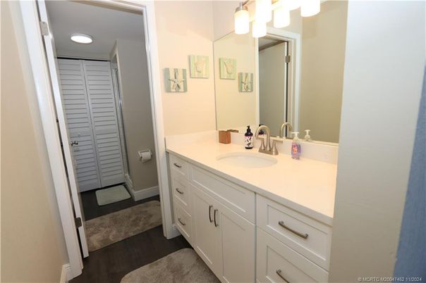 Bathroom, Dual Sink Vanities, Interior, Recessed Lighting, Wood Texture Flooring