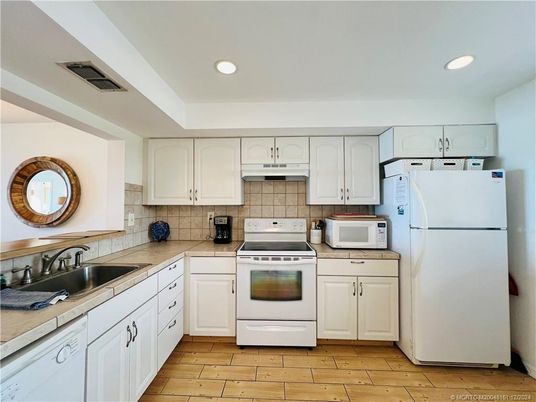 Interior, Kitchen, Recessed Lighting, Tile Countertops, Wood Texture Flooring