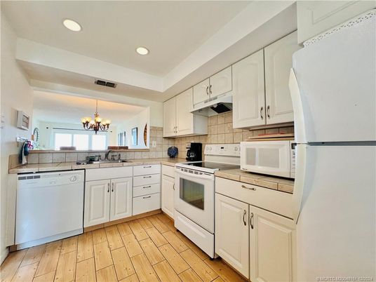 Chandelier, Interior, Kitchen, Recessed Lighting, Tile Countertops, Wood Texture Flooring