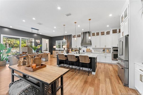 Dining room, Interior, Kitchen, Pendant Lights, Recessed Lighting, Stainless Steel Appliances, Wood Texture Flooring