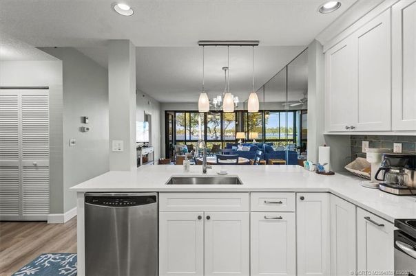 Dining room, Interior, Kitchen, Pendant Lights, Recessed Lighting, Stainless Steel Appliances, Wood Texture Flooring