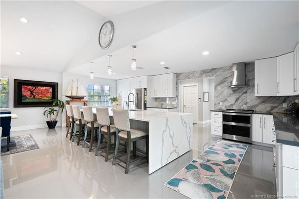 Interior, Kitchen, Marble Walls, Pendant Lights, Recessed Lighting, Stainless Steel Appliances