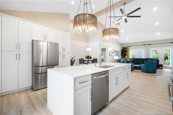 Chandelier, Interior, Kitchen, Living room, Pendant Lights, Recessed Lighting, Stainless Steel Appliances, Wood Texture Flooring