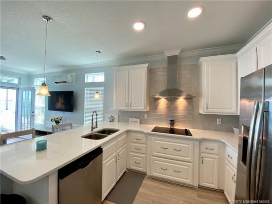 Dining room, Interior, Kitchen, Pendant Lights, Recessed Lighting, Stainless Steel Appliances, Wood Texture Flooring