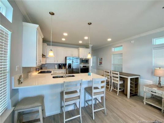 Dining room, Interior, Kitchen, Pendant Lights, Recessed Lighting, Stainless Steel Appliances, Wood Texture Flooring