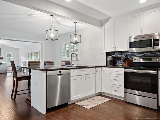 Dining room, Interior, Kitchen, Pendant Lights, Recessed Lighting, Stainless Steel Appliances, Wood Texture Flooring