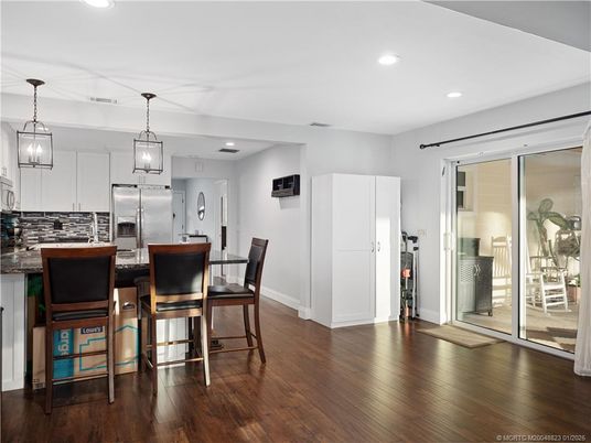 Dining room, Interior, Kitchen, Pendant Lights, Recessed Lighting, Stainless Steel Appliances, Wood Texture Flooring