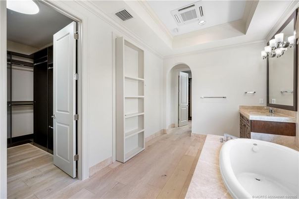 Bathroom, Dual Sink Vanities, Free Standing Baths, Interior, Recessed Lighting, Walk-in Closets, Wood Texture Flooring