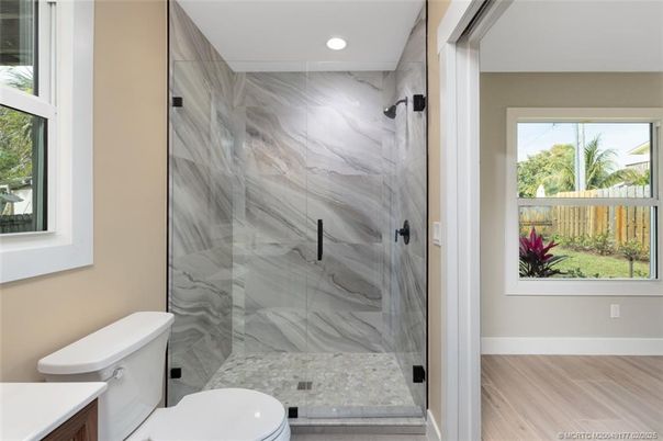 Bathroom, Glass Shower, Interior, Marble Walls, Recessed Lighting, Wood Texture Flooring
